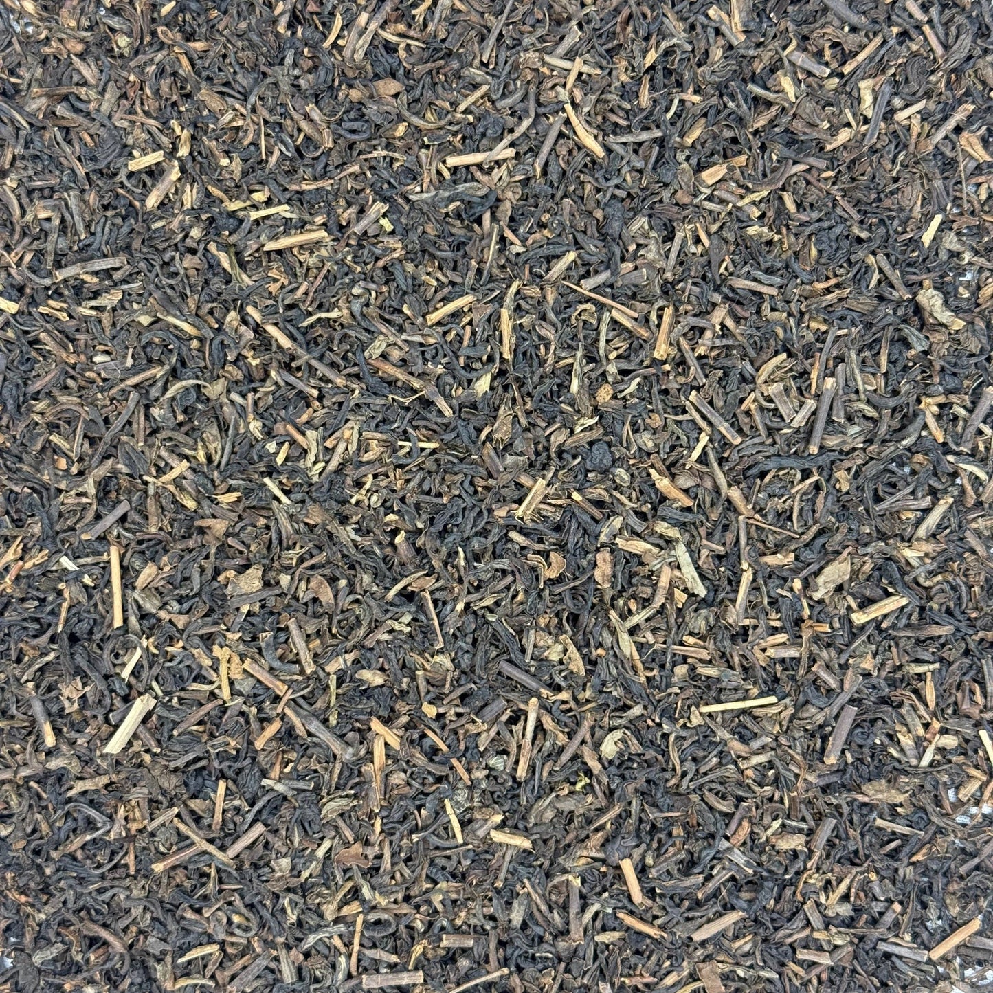 Close-up of Decaffeinated black tea leaves on a white background